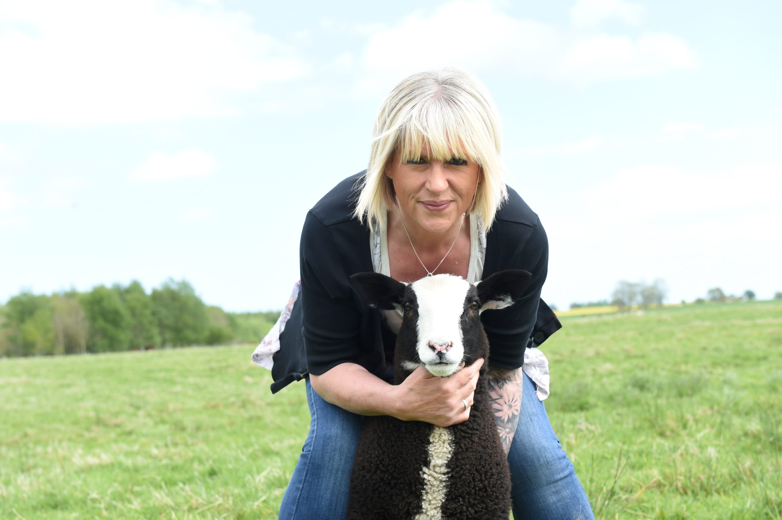Gizmo the lamb and Sandra Bolton. Picture by Paul Glendell