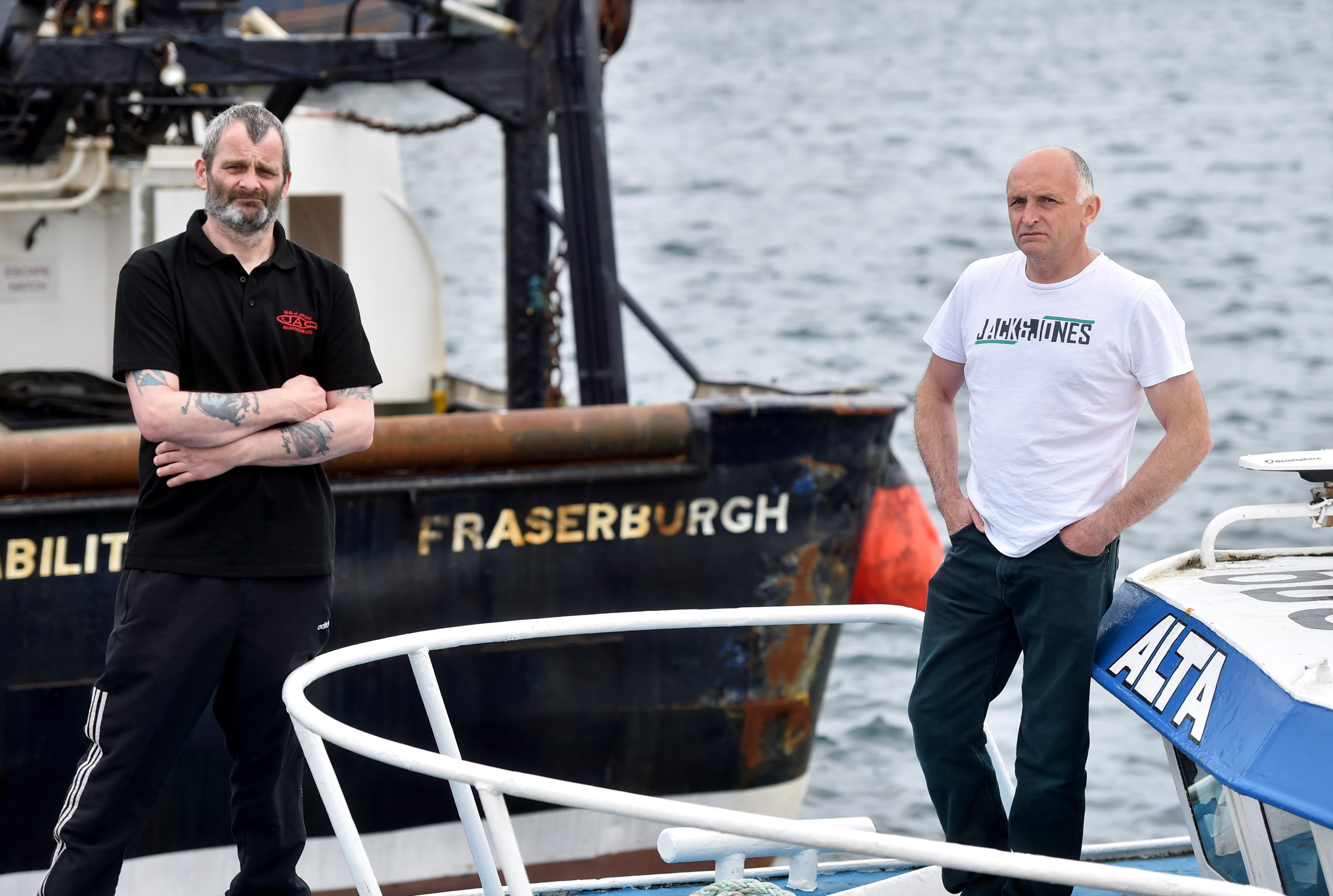 Fisherman Michael Ritchie (left) and Robert Souter (right) at Fraserburgh Harbour. 
Picture by Scott Baxter