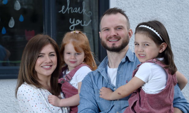 Former cancer patient, David Kennedy with his wife Mae and daughters Harriet (3) and Lotte (6). Picture by Sandy McCook