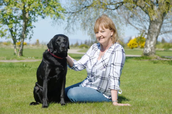 Eleanor Dexter with her own dog 'Boris' at Culloden.