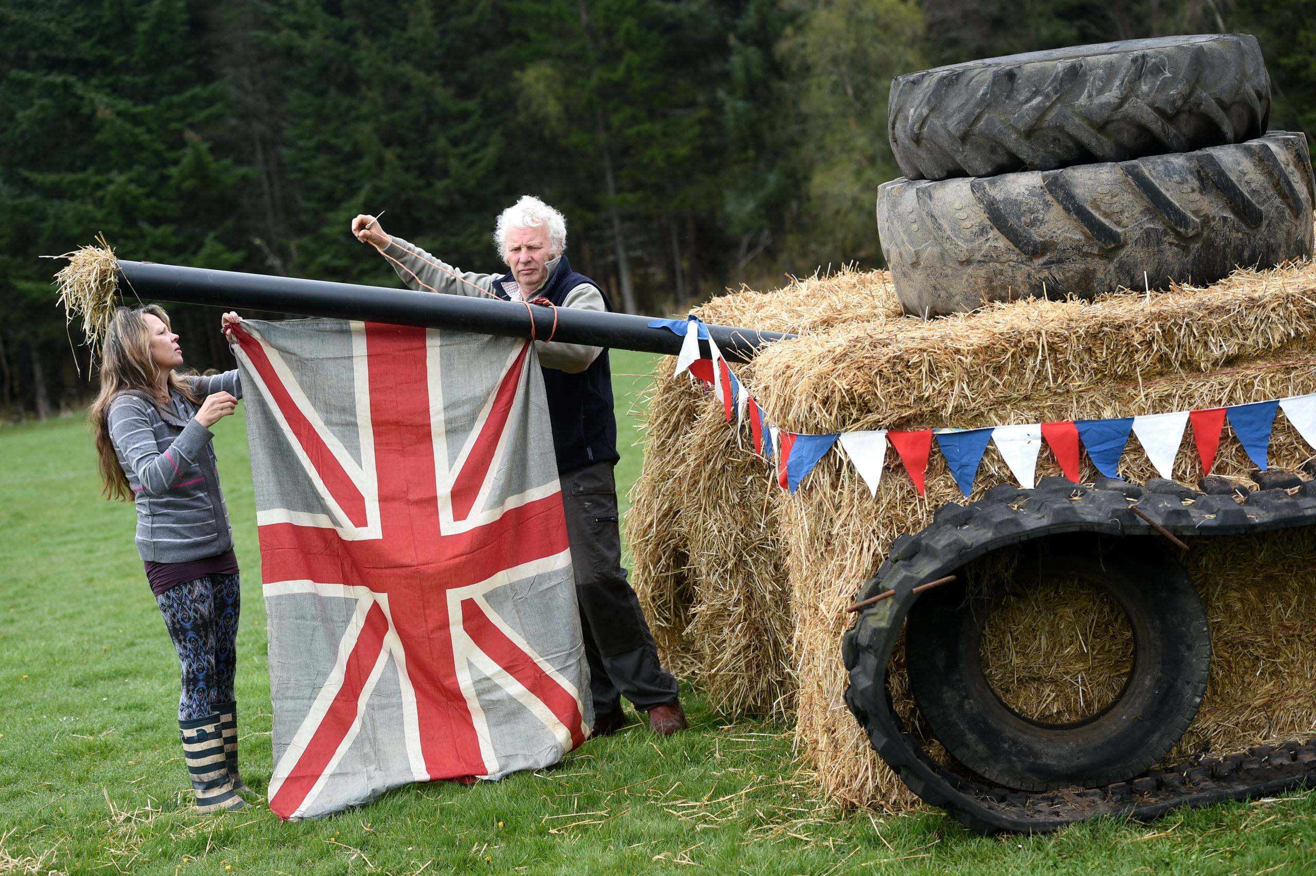 Sylvia McFarlane and John Kirk put the finishing touches to a bale art tank in Nethy Bridge. Picture by Sandy McCook
