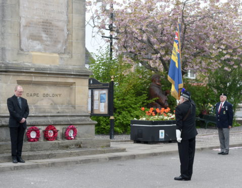 Beauly and District Royal British Legion Scotland (RBLS) yesterday held a very short service of remembrance on the 75th anniversary of VE Day in 1945. (L-R) Rev. Ian Manson, Bob Coburn Branch Chairman and Trevor Carnall Vice chairman who laid the wreath. Picture by Sandy McCook
