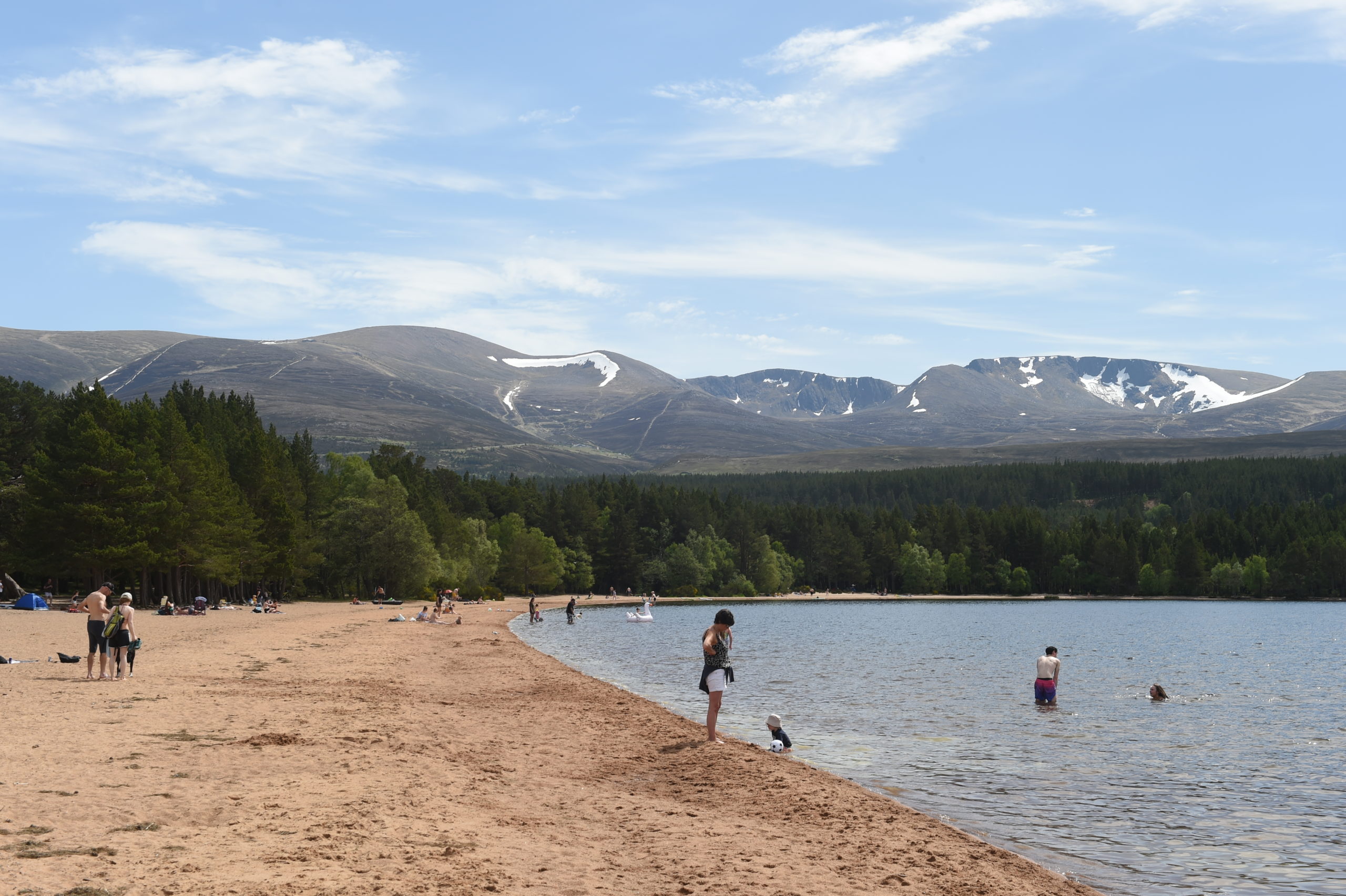 People enjoy the warm weather at Loch Morlich following the ease of lockdown measures.
Picture by Sandy McCook.