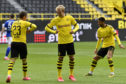 Dortmund's Thorgan Hazard, left, celebrates with Erling Haaland after scoring his side's third goal during the German Bundesliga soccer match between Borussia Dortmund and Schalke 04 in Dortmund, Germany.