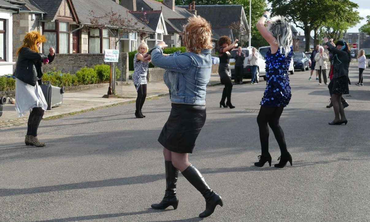 Residents of Norfolk Road dancing to entertain their neighbours.