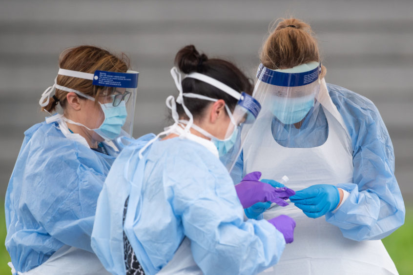 NHS staff at a testing centre.