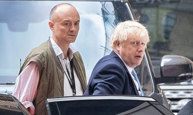 Prime Minister Boris Johnson arrives at Parliament with his special advisor Dominic Cummings.