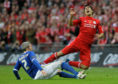 Cardiff City's Kevin McNaughton, left, tackles Liverpool's Luis Suarez during the English League Cup final in 2012.