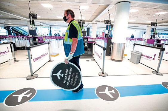 A one-way system has been put in place through Edinburgh Airport, one of the social distancing measures to help limit contact with airport staff and travellers.