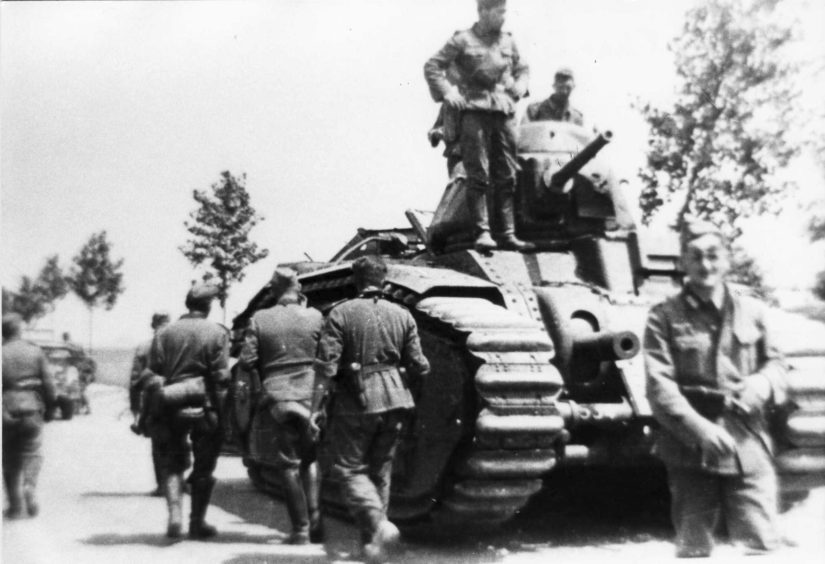 German troops with a Char B tank used by the Nazi forces during the occupation of Jersey in the Second World War.