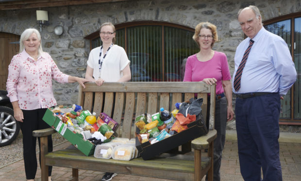 Administrators of Food For Families Alex Gilchrist and Lynne Grant and founders Anne and David Sutherland have served up 1,000 meals during lockdown.