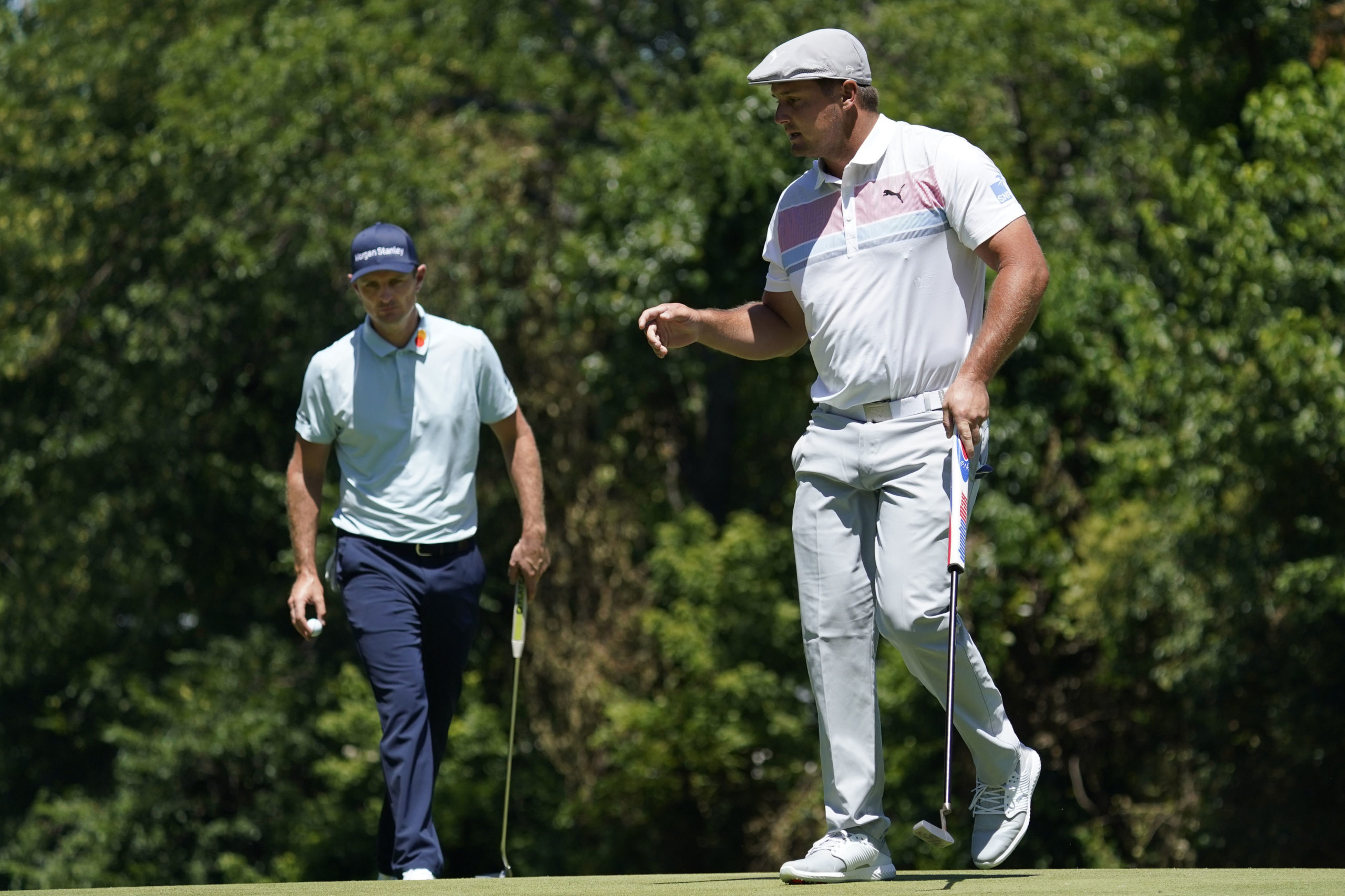 Bryson DeChambeau, right, has bulked up dramatically.