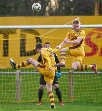 Howarth, right, competes for the ball during his time with the Can-Cans.