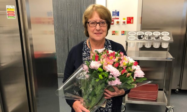 Katie Campbell has been recognised for serving up 1.8 million school meals over 45 years at the school