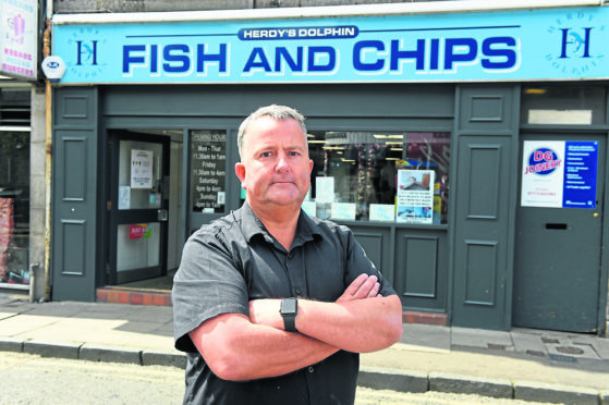 Graeme Herd, of Dolphin Fish And Chips, Chapel Street, has started a petition calling on Aberdeen City Council to "stop killing small businesses" with their physical distancing traffic measures. 
Picture by Kenny Elrick
