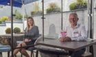 The Seafield Arms in Cullen has installed protective screens between tables for diners. Pictured: Manager Donald Thain, pictured right, and deputy manager Ailie Flett. Picture and video by Jason Hedges.