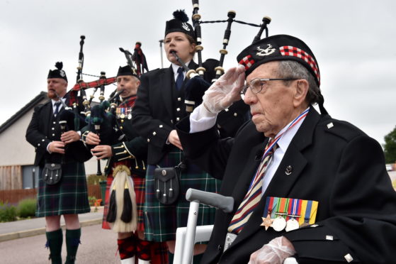 Donald Smith, pictured right, with pipers Jonathan Scott, Donald Stewart, Emma Lawrence. Picture: Kenny Elrick.