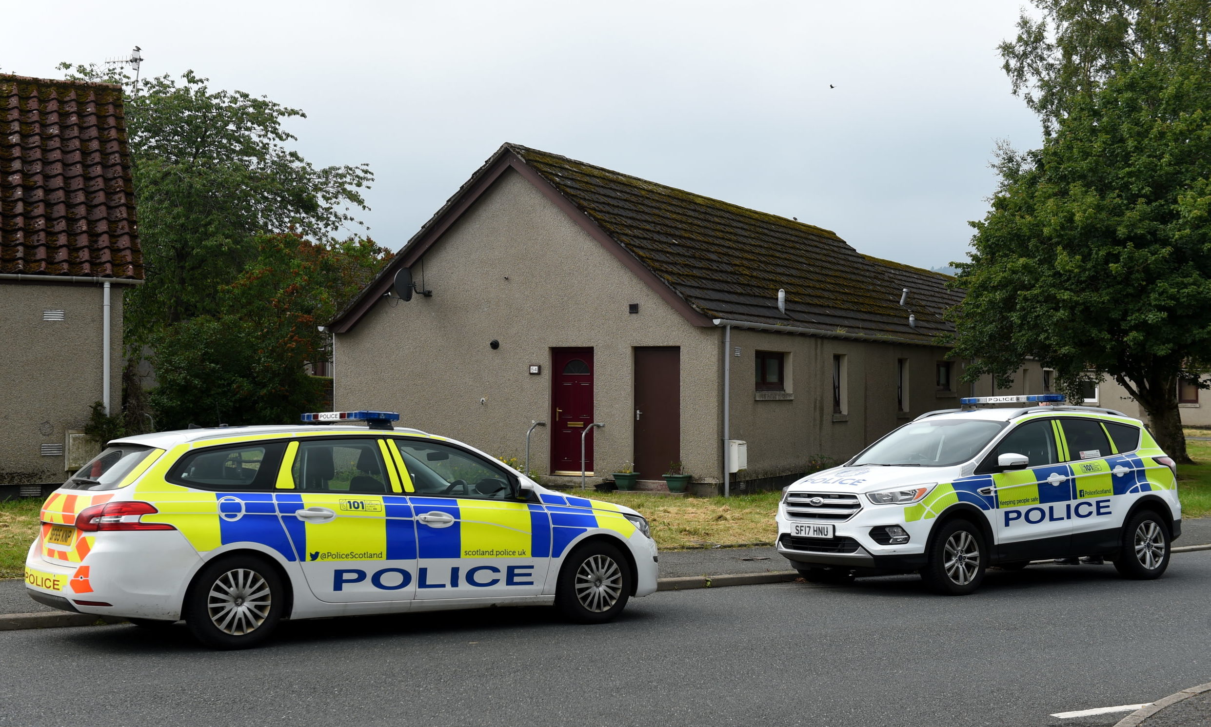 Police at Scott Drive, near Scott Court, Huntly, following the incident. Picture by Kenny Elrick