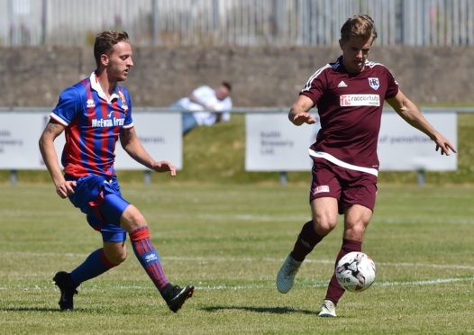Ryan Keir takes on Caley Thistle's Tom Walsh in a pre-season friendly in 2018.
Picture by Kenny Elrick