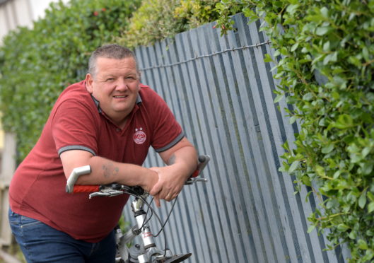 John Eden, manager at Boddam United completed a fundraising cycling challenge within four weeks after he was ill for six weeks with suspected Covid-19.