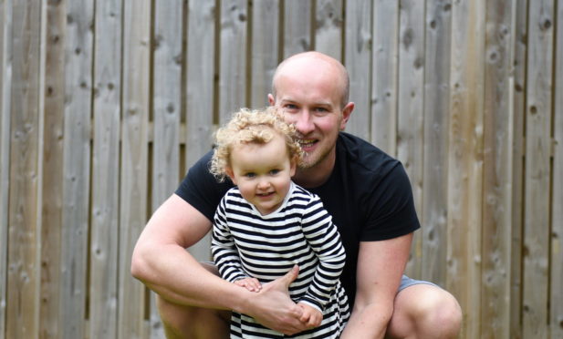 Matt and Lux Irvine playing in their garden 

Picture by Paul Glendell