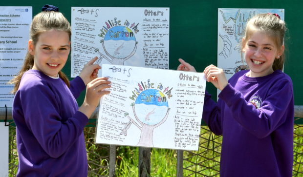 Pictured are from left, winning poster designers, Isla Smith 11, Lexie Murray 10. Picture by Chris Sumner.