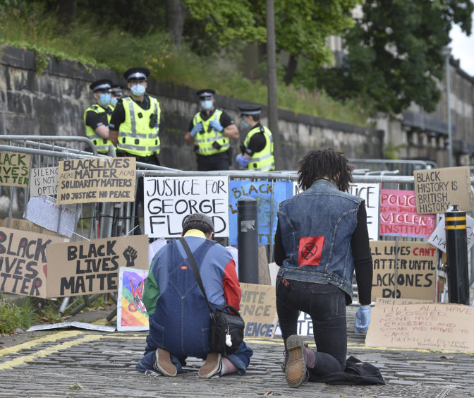 Demonstrators gathered outside the US consulate in Edinburgh