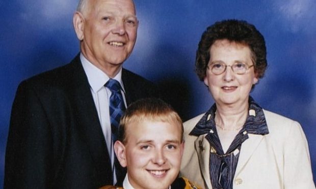 Sandy Ingram, left, with wife Ann and son Andrew at his graduation.