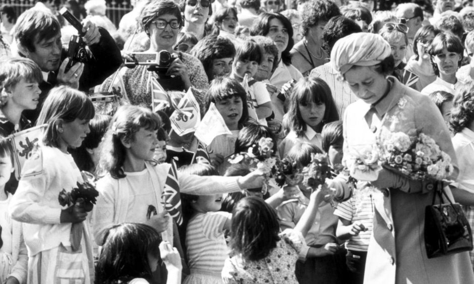 Youngsters with posies surround the Queen at the opening of Aberdeen's Queen Elizabeth Bridge in August, 1984. The Queen opened the £5.7 million bridge which is named after her. It replaced the Wellington Suspension Bridge over the Dee between Torry and Ferryhill.