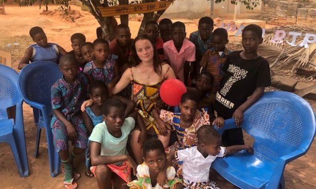 Julia Farquhar celebrating her 18th birthday with the children of Lokokorpe