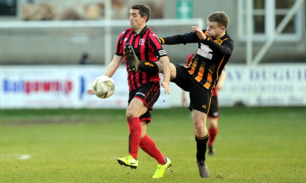 Neil McLean and Huntly's Alexander Jack. Picture by Colin Rennie