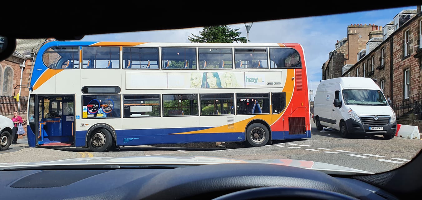 The double-decker Stagecoach bus blocks the junction of Haugh Road and Castle Road
