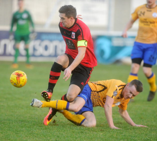 Inverurie's Neil McLean and Wick's Gary Manson.