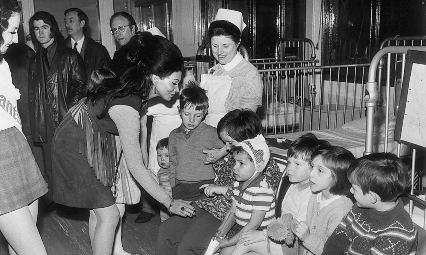 Children talk to Miss World, Jennifer Hoston,  when she visited Ward 4 of Royal Aberdeen Children's hospital at Foresterhill in June 1971.