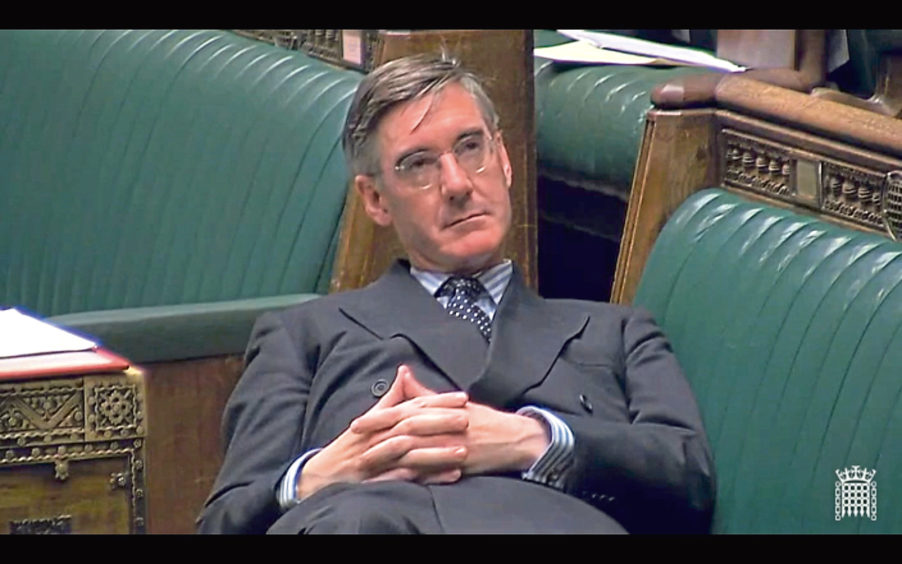 Jacob Rees-Mogg reclining in the House of Commons last year.