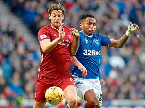 Ash Taylor battles with Alfredo Morelos.