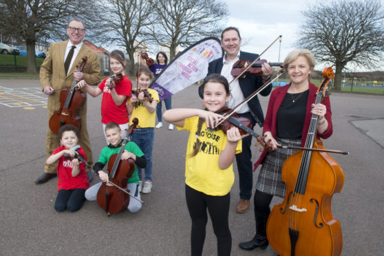 L-R: Benny Higgins, Councillor Douglas Lumsden and Councillor Jenny Laing with children from Big Noise Torry.