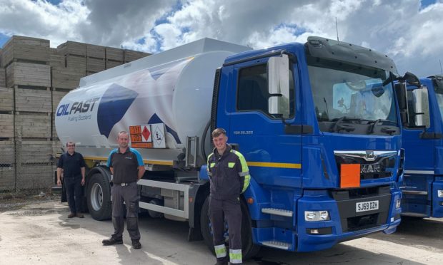 (Left) Carl Stewart with Account Manager Tommy Fraser and Tanker Driver Steven Sharpe from Inverness Depot.