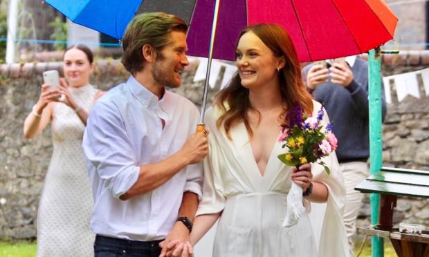Iona Macgowan, 26, and Connan Cooper, 28, tied the knot in their back garden.