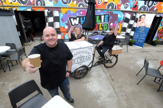 Wheelie World in Queen Street Peterhead have turned their courtyard into a new outdoor cafe.
Pictured l-r Willie Cruden, Niocla Cruden and their son Lyall.
Picture by Chris Sumner