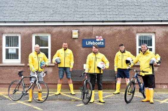 Pictured are the RNLI volunteers from left, Andy Simpson, George Rhind, Craig Aird, Gordon MacLeod and Michael Ritchie at Peterhead Lifeboat RNLI Base. Picture by DARRELL BENNS