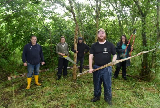 L-R: William Swales, Ewan Anderson, Jasmine Bray, outdoor instructor Lewis Swales and Lynn Turner at The Brave Outdoors Community Woodland, Peterhead. 
Picture by Darrell Benns.