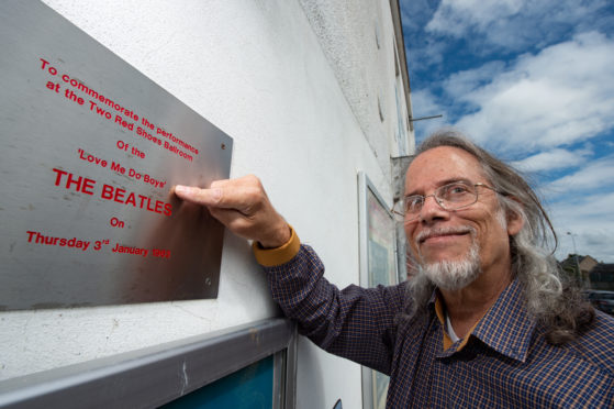 Music writer David Dills outside the former Two Red Shoes in Elgin, where The Beatles performed in 1963.