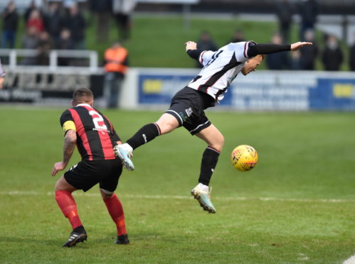 Conor O'Keefe, right, in action for Elgin.