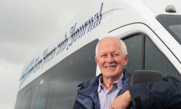 Jim Patterson, a member of Burghead and Cummingston Community Council, with the minibus won from the P&J. Picture by Jason Hedges.