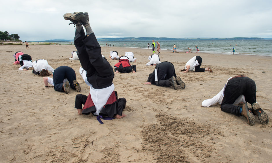 Extinction Rebellion protesters at Nairn beach.
Pictures by Jason Hedges.