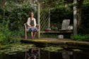 Psychotherapist Julia Lay within her tranquil therapy garden for client use.
Pictures by Jason Hedges.