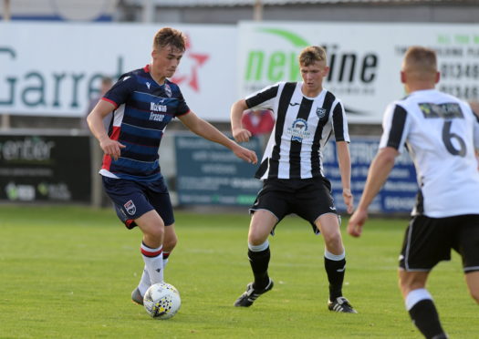 Joel MacBeath, left, in action for Ross County.