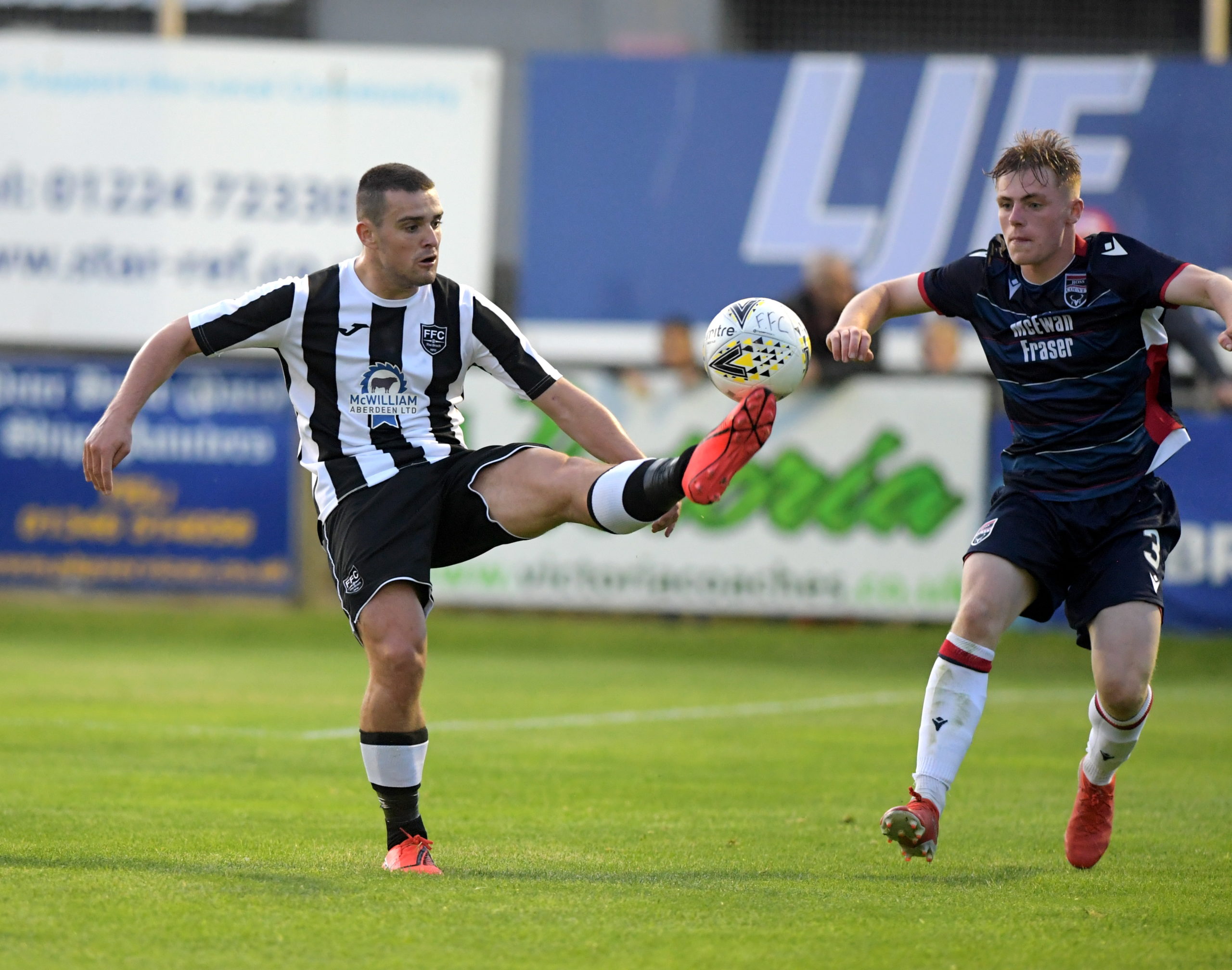 Fraserburgh's Scott Barbour and Ross County's Josh Reid.
Picture by KATH FLANNERY