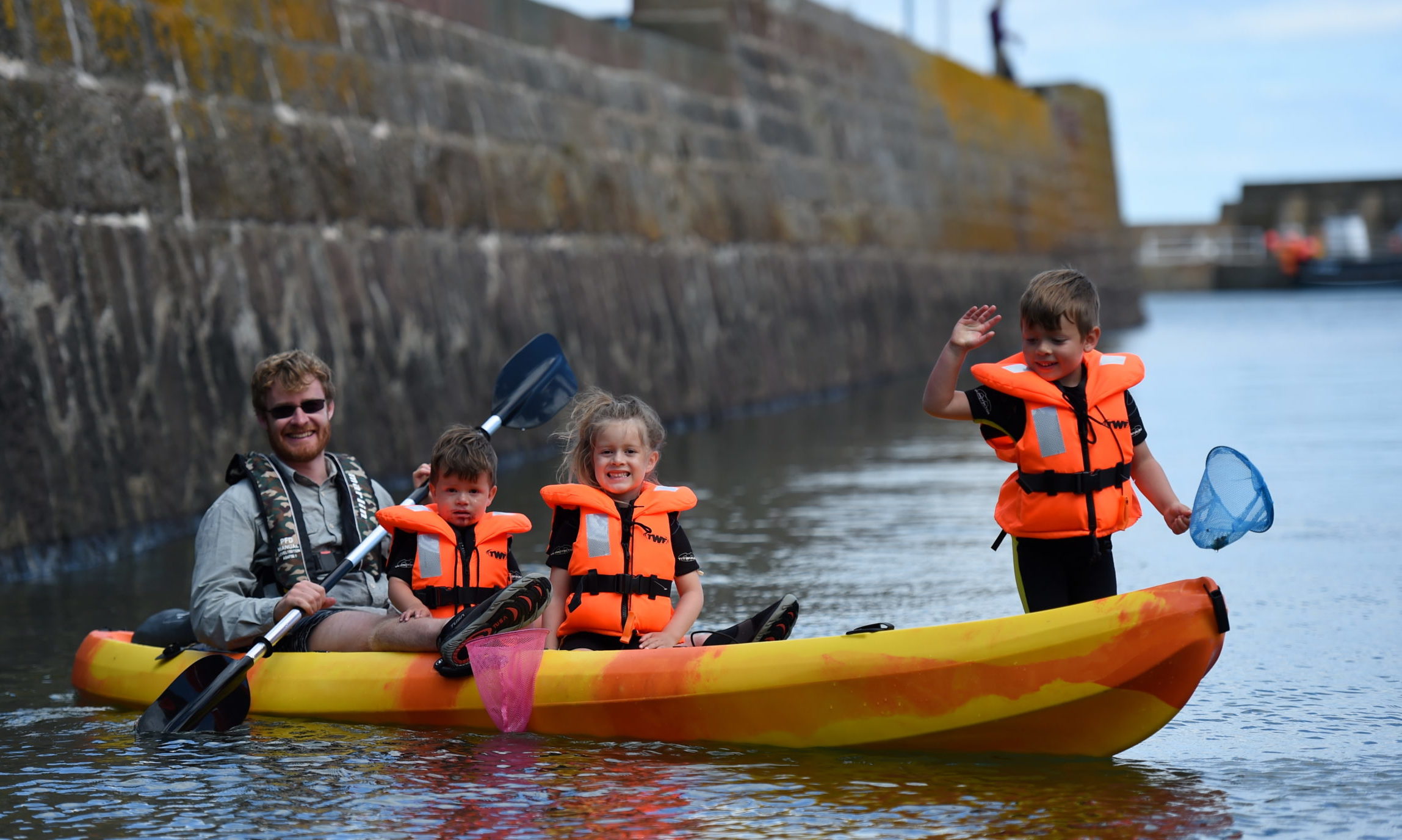 The Bottomley  family  'crabbing' from their canoe in Stonehaven harbour 

Picture by Paul Glendell